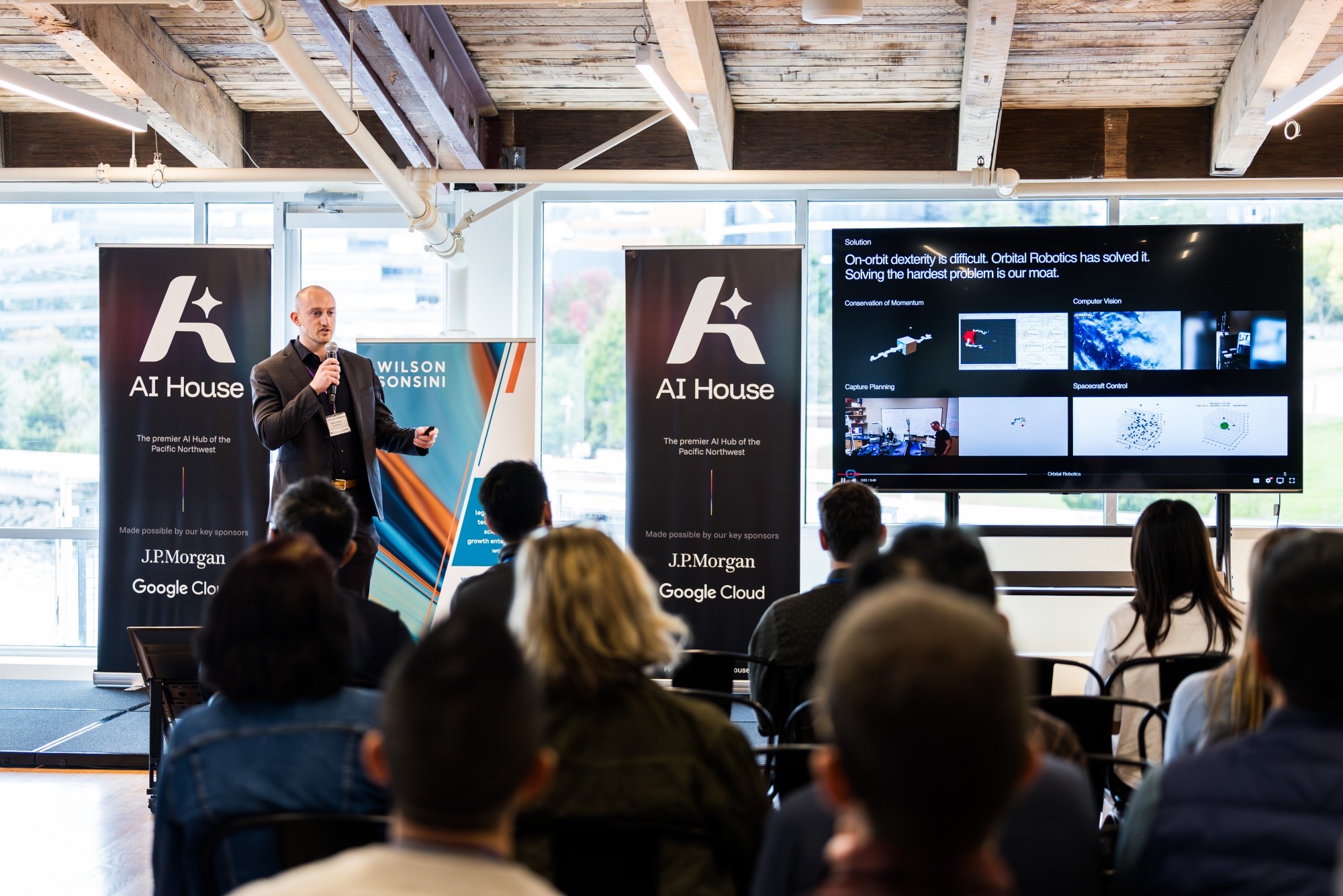 A founder pitches on stage at AI House Demo Day 2026